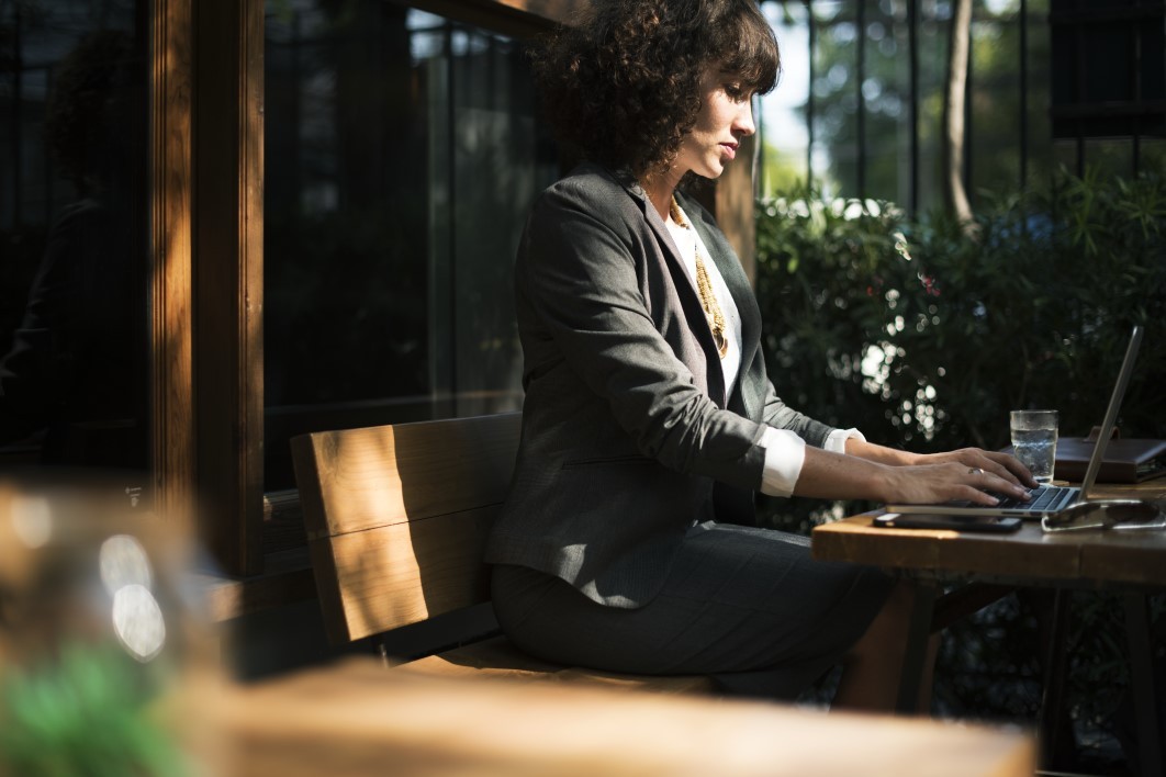 1576835139-negative-space-woman-laptop-glass-water-wood-desk-office-rawpixel-thumb-1